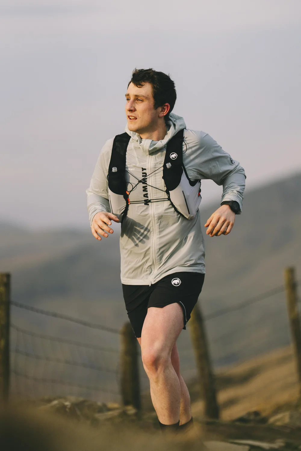 Trail runner in Mammut kit on Mam Tor ridge