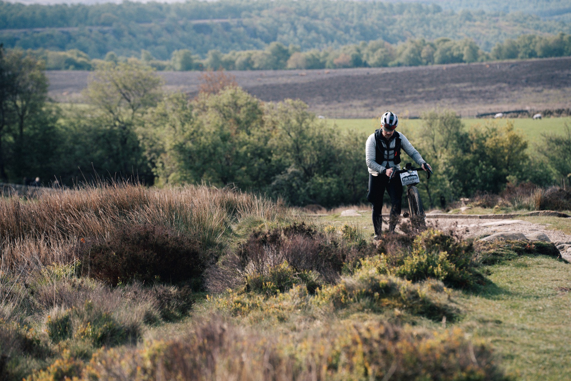 Tor Divide rider crossing Peak District moorland